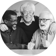three elderly men laughing